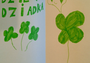 Laurka wykonana prze ucznia uczęszczającego do świetlicy. Przedstawia liście zielonej czterolistnej koniczyny; u góry znajduje się napis: „Dzień Dziadka".